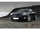 Pilt Sports Car Under Storm Clouds